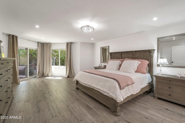 8719 E San Marino Dr, Scottsdale, AZ 85258 - bedroom featuring light wood-style flooring, access to outside, and recessed lighting