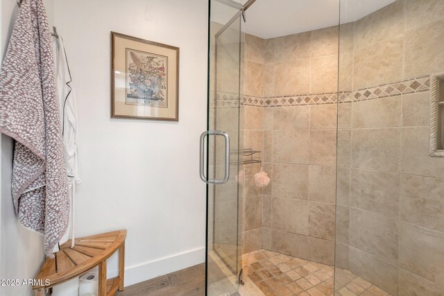 8719 E San Marino Dr, Scottsdale, AZ 85258 - bathroom with baseboards, wood finished floors, and a stall shower