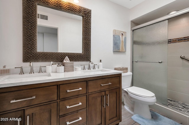 8719 E San Marino Dr, Scottsdale, AZ 85258 - full bathroom with toilet, a sink, double vanity, and a stall shower
