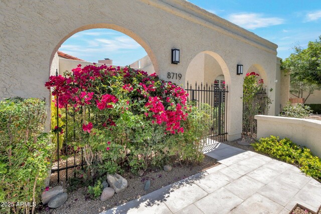 8719 E San Marino Dr, Scottsdale, AZ 85258 - exterior space featuring a gate and fence
