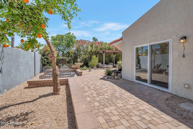 8719 E San Marino Dr, Scottsdale, AZ 85258 - view of patio featuring fence and a pergola