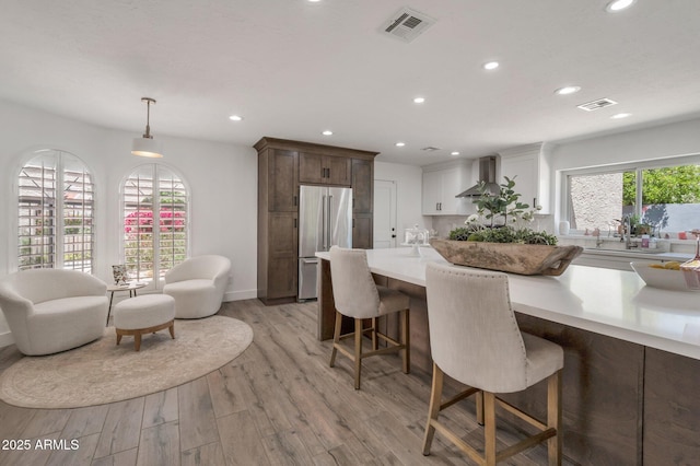 8719 E San Marino Dr, Scottsdale, AZ 85258 - dining room with recessed lighting, light wood-style floors, and visible vents