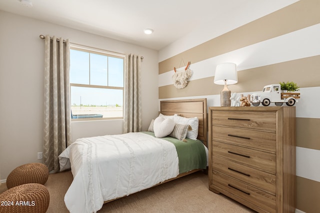 bedroom featuring light colored carpet