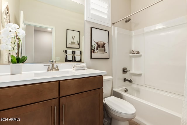 bathroom featuring toilet, shower / tub combination, and vanity