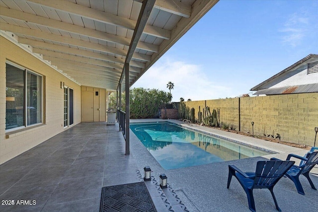 view of swimming pool with a patio area, a fenced in pool, and a fenced backyard