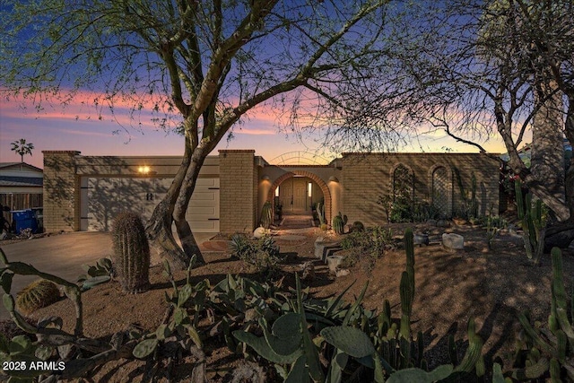 view of front of house featuring driveway and a garage