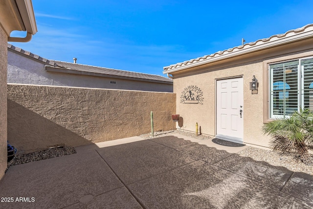 property entrance with a patio area