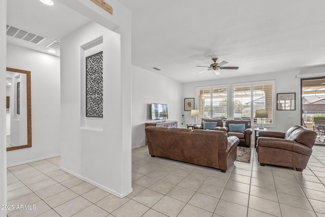 living room with ceiling fan and light tile patterned flooring