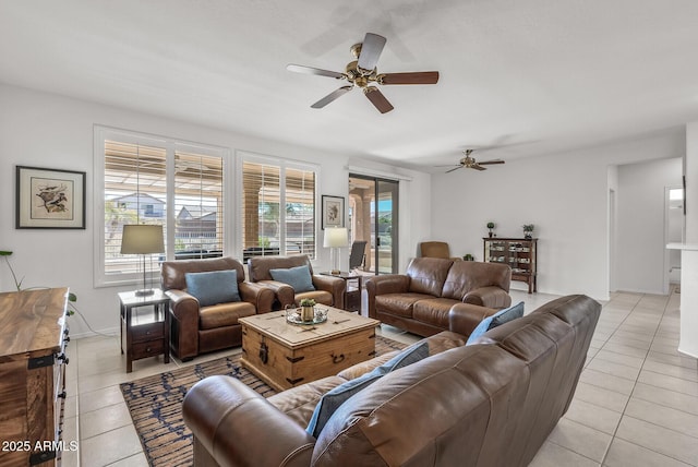 living room with ceiling fan and light tile patterned floors