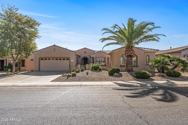 mediterranean / spanish house featuring a garage