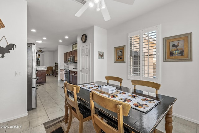 dining room featuring ceiling fan and light tile patterned flooring