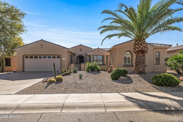 mediterranean / spanish-style home with a garage