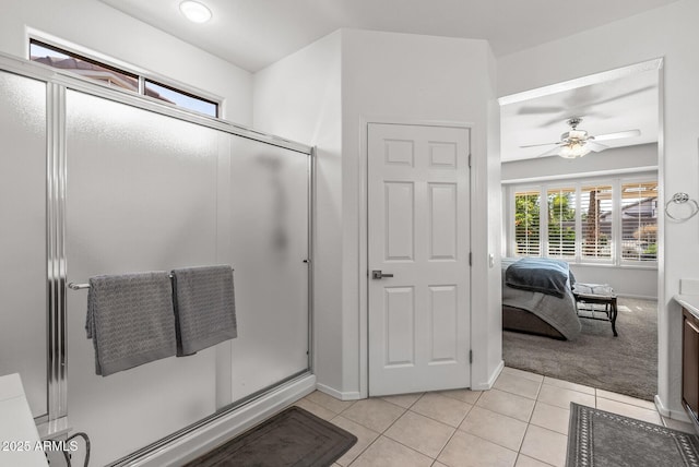 bathroom with ceiling fan, vanity, tile patterned floors, and walk in shower