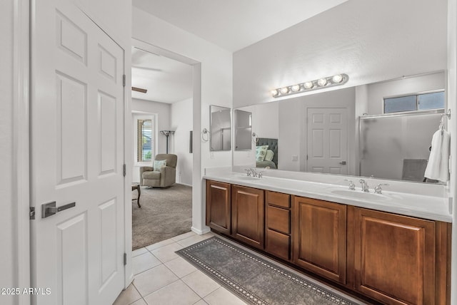 bathroom with tile patterned floors and vanity