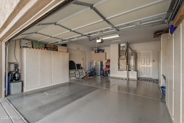 garage with water heater, a garage door opener, and stainless steel refrigerator