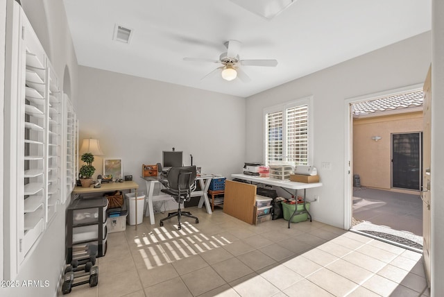 office featuring ceiling fan and light tile patterned floors