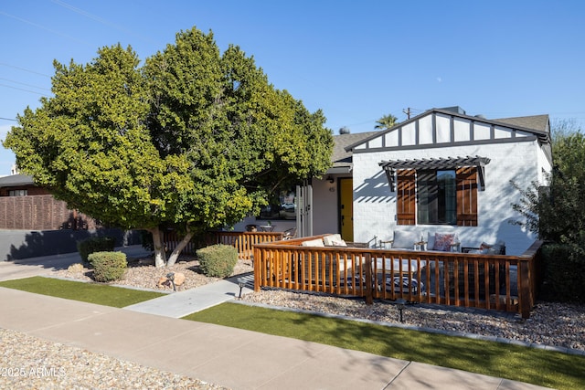 back of property with a wooden deck