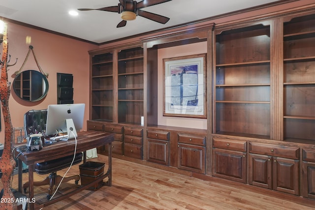 office space with light wood finished floors, ceiling fan, and ornamental molding