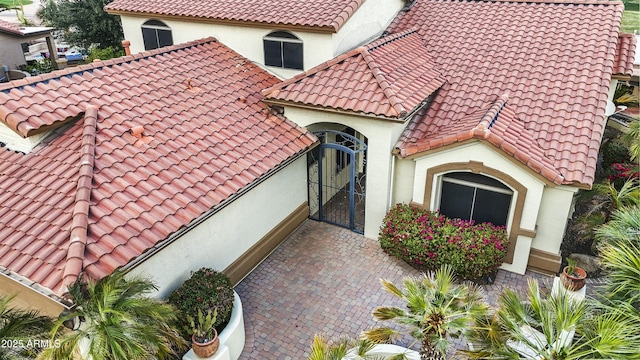 view of front of property featuring stucco siding and a tile roof