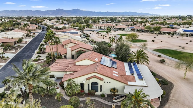 birds eye view of property with a mountain view and a residential view
