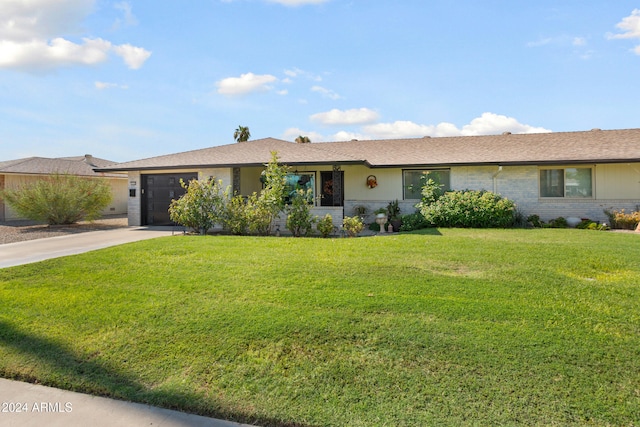 ranch-style home with a front yard, brick siding, driveway, and an attached garage