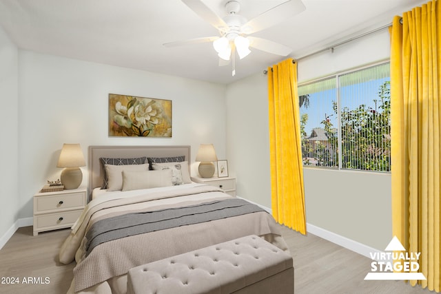 bedroom featuring light hardwood / wood-style flooring and ceiling fan