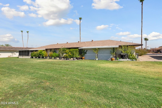 ranch-style home with a front yard