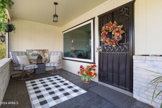 view of exterior entry featuring a porch