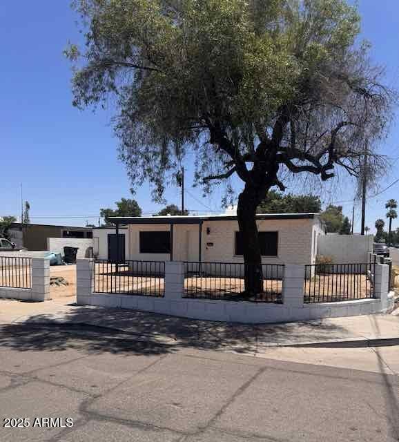 7201 N 26th Ln, Phoenix, AZ 85051 - view of front of property featuring a fenced front yard and a gate