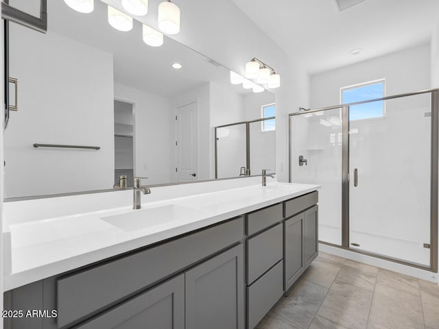 17815 W Denton Ave, Litchfield Park, AZ 85340 - bathroom featuring double vanity, a shower stall, and recessed lighting