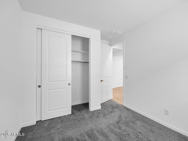 17815 W Denton Ave, Litchfield Park, AZ 85340 - unfurnished bedroom featuring carpet, a closet, and baseboards