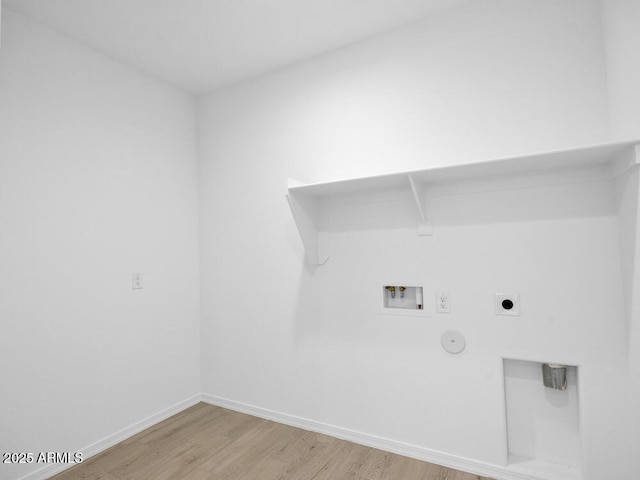 17815 W Denton Ave, Litchfield Park, AZ 85340 - laundry room with hookup for a gas dryer, light wood-style flooring, hookup for a washing machine, electric dryer hookup, and baseboards