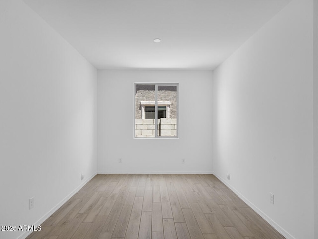 17815 W Denton Ave, Litchfield Park, AZ 85340 - empty room with wood finished floors and baseboards