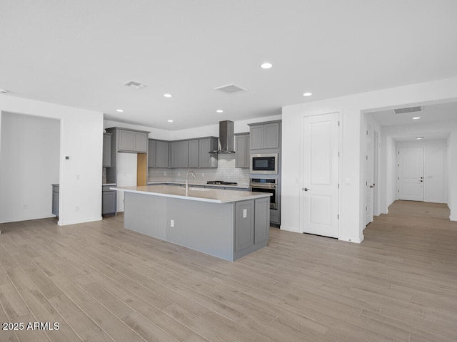 17815 W Denton Ave, Litchfield Park, AZ 85340 - kitchen featuring wall chimney range hood, gray cabinetry, built in microwave, stainless steel oven, and recessed lighting
