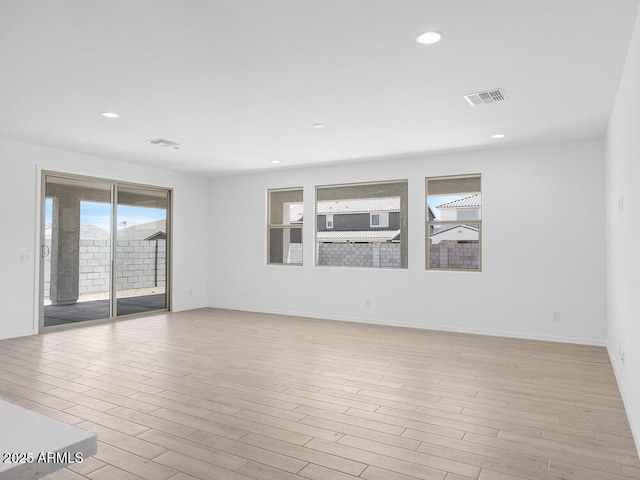 17815 W Denton Ave, Litchfield Park, AZ 85340 - spare room featuring plenty of natural light, light wood-type flooring, recessed lighting, and baseboards