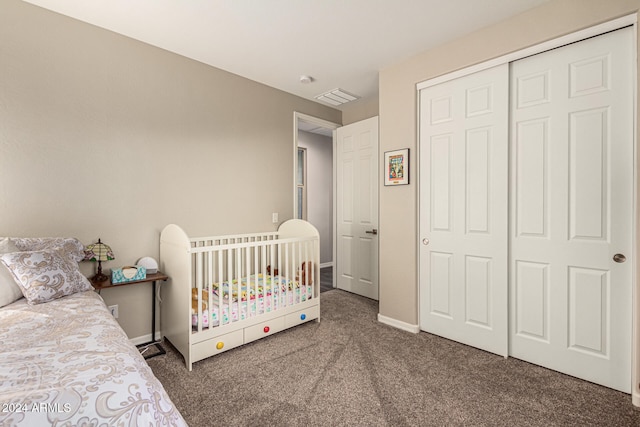 carpeted bedroom featuring a closet