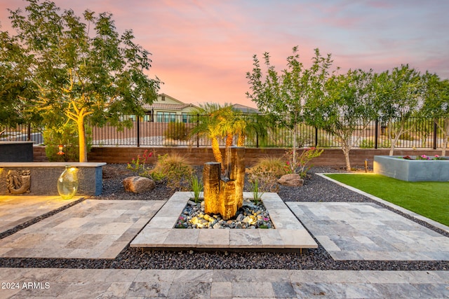 view of patio terrace at dusk