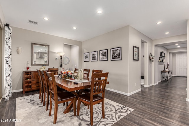 dining room with dark hardwood / wood-style floors