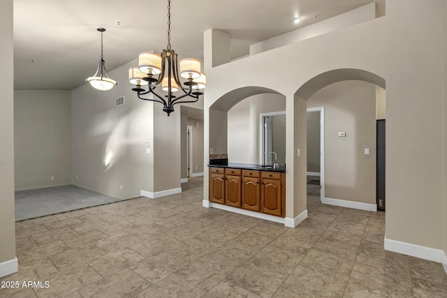 interior space with sink and a chandelier