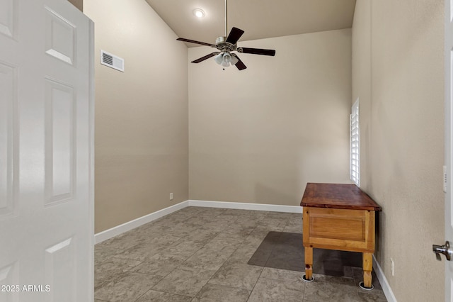 unfurnished room featuring ceiling fan and lofted ceiling