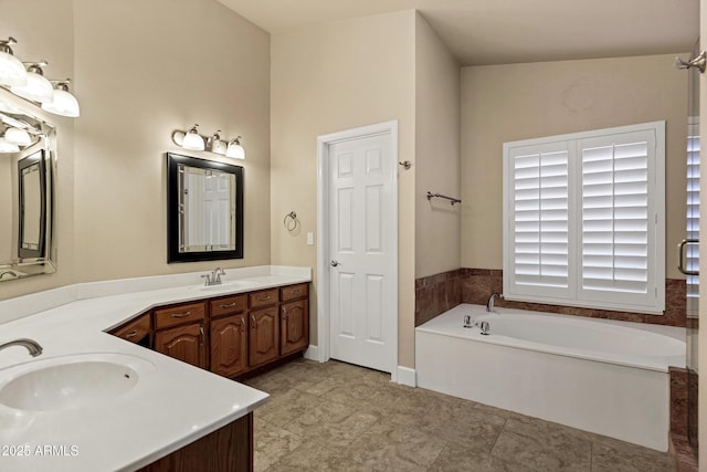 bathroom featuring a tub to relax in and vanity