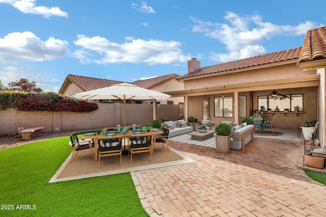 view of patio with ceiling fan and outdoor lounge area