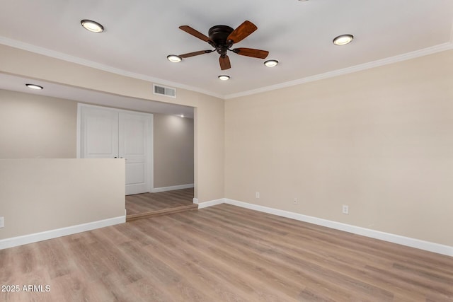 1535 E Kenwood St, Mesa, AZ 85203 - unfurnished room with ornamental molding, baseboards, a ceiling fan, light wood-style flooring, and recessed lighting