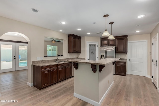 1535 E Kenwood St, Mesa, AZ 85203 - kitchen featuring stainless steel refrigerator with ice dispenser, a sink, dark brown cabinetry, a center island, and recessed lighting