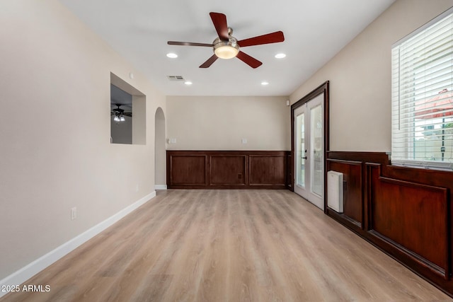 1535 E Kenwood St, Mesa, AZ 85203 - empty room with ceiling fan, light wood finished floors, arched walkways, a wainscoted wall, and recessed lighting