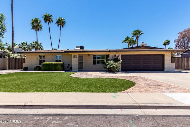 1535 E Kenwood St, Mesa, AZ 85203 - ranch-style house featuring driveway, an attached garage, and brick siding