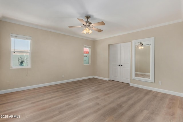 1535 E Kenwood St, Mesa, AZ 85203 - empty room featuring light wood-style floors, ceiling fan, baseboards, and ornamental molding