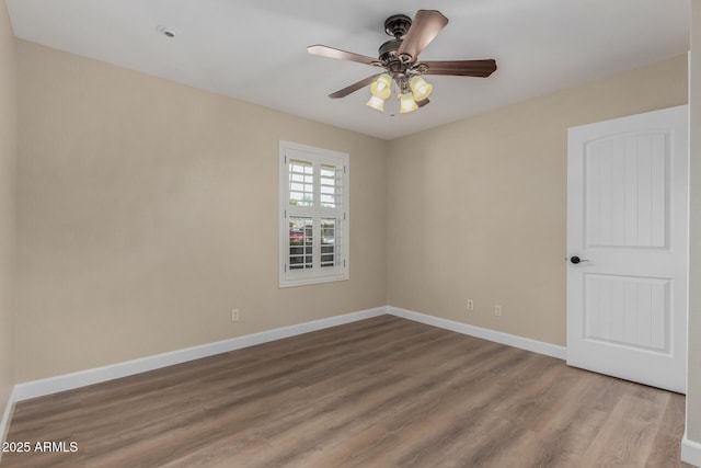 1535 E Kenwood St, Mesa, AZ 85203 - spare room featuring wood finished floors, baseboards, and a ceiling fan