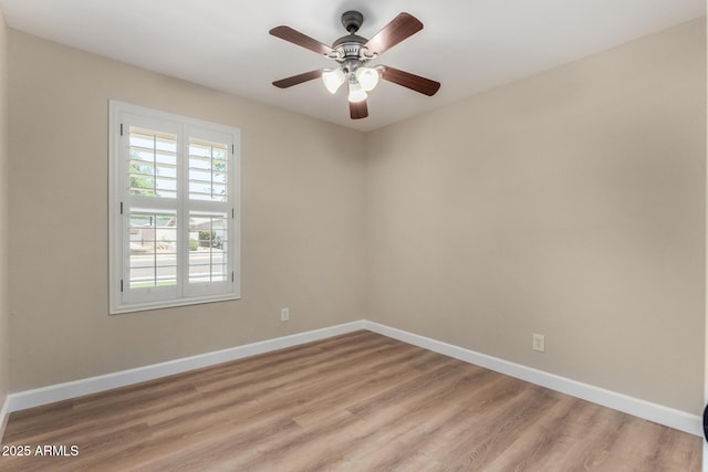 1535 E Kenwood St, Mesa, AZ 85203 - empty room with baseboards, light wood-style flooring, and ceiling fan