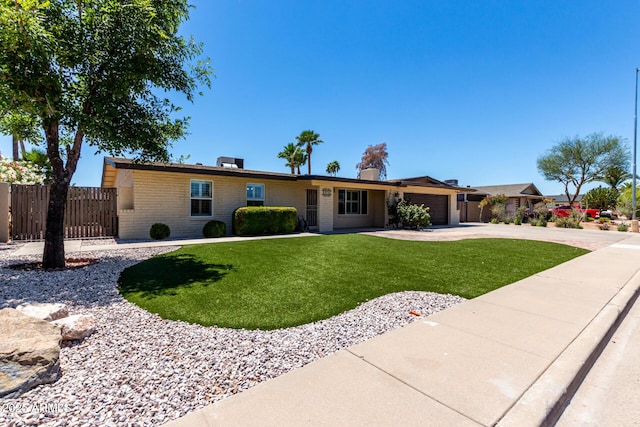 1535 E Kenwood St, Mesa, AZ 85203 - ranch-style house with a garage, driveway, and brick siding